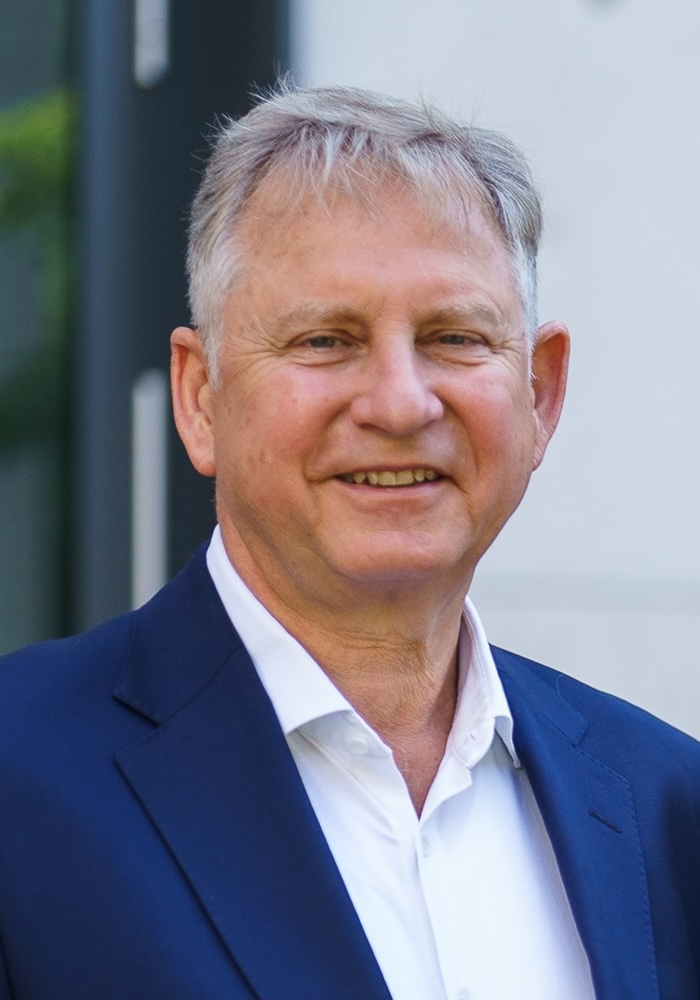 Portrait of an older man in a dark suit