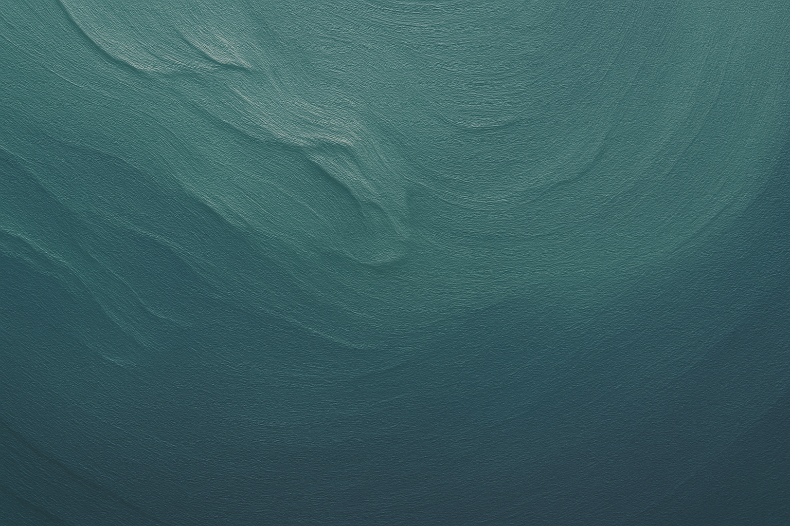 Calm green water surface with gentle ripples and reflections of light