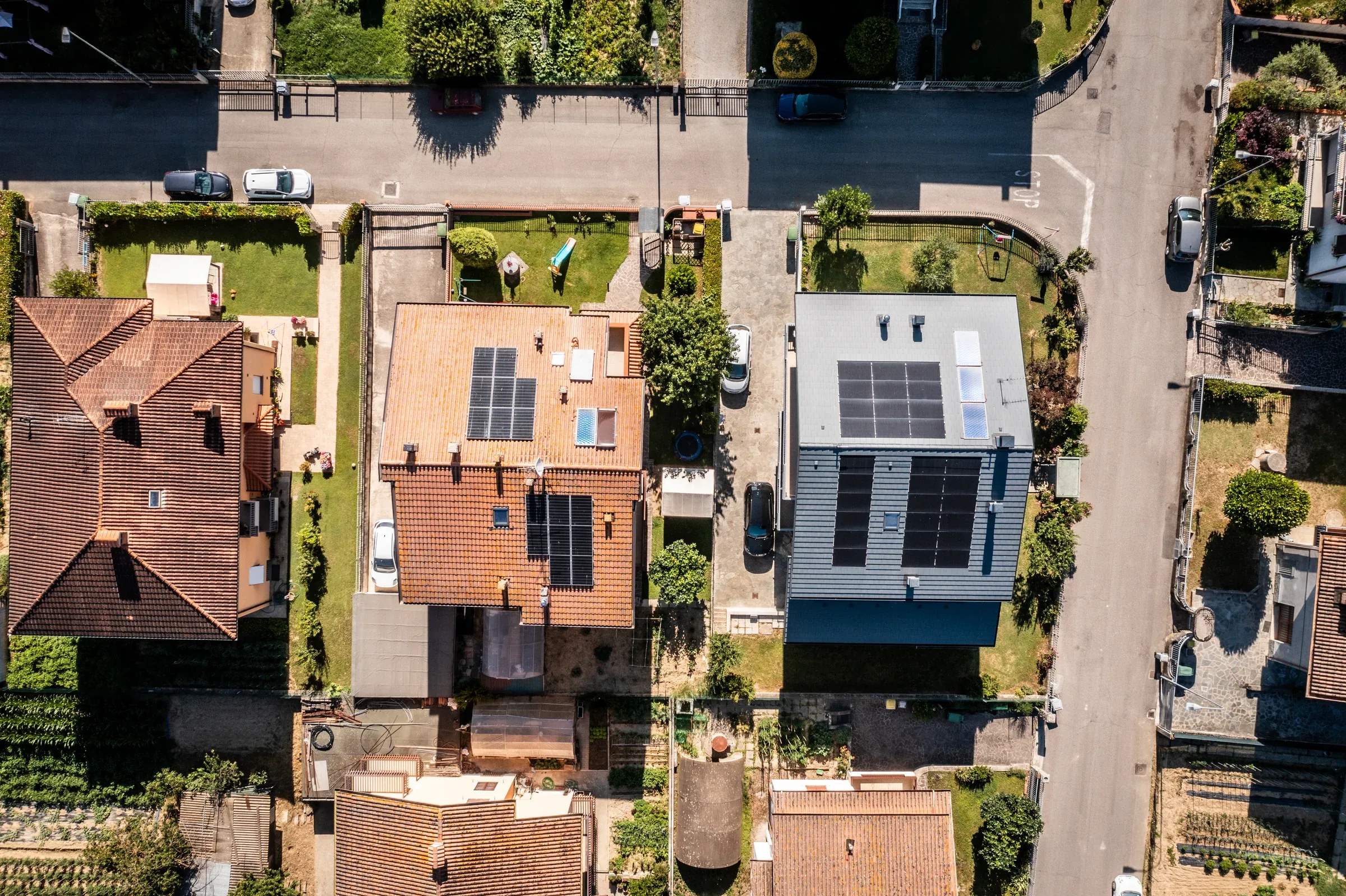 Aerial view of houses with solar panels on the roofs